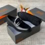 A pair of luxurious black loafers displayed on a shoe box, exuding sophistication and elegance. The sleek design and premium materials are showcased in this high-quality image.